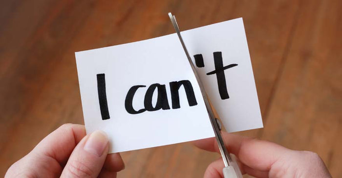 Hand cutting piece of paper 